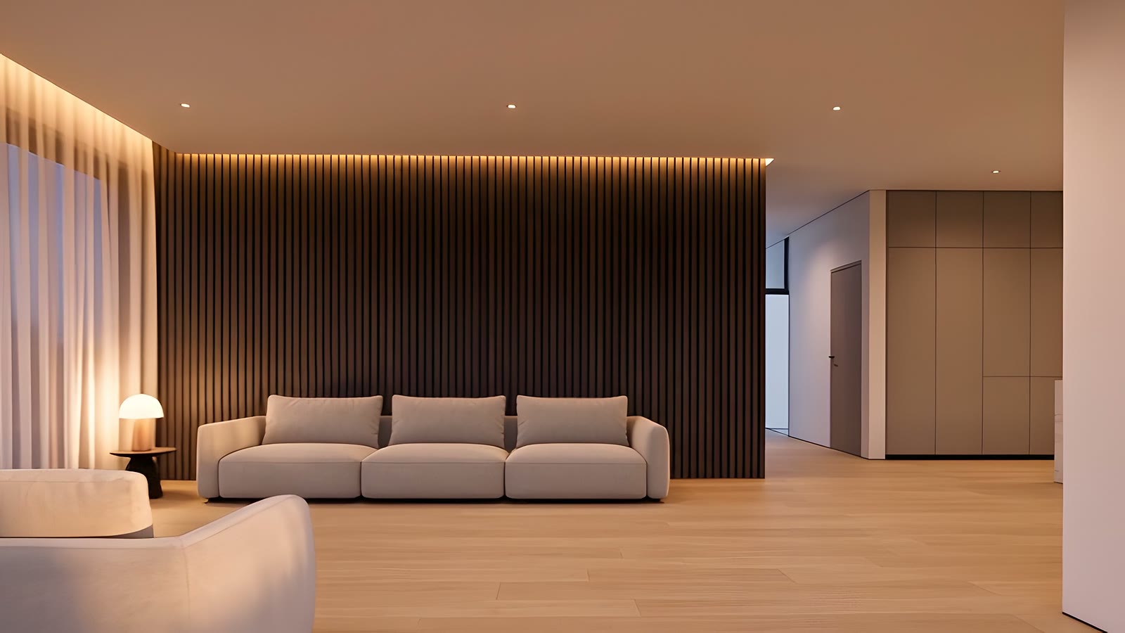 A generous living room with a low pale sofa in front of a dark timber slat wall.